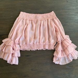 pink ruffled shirt